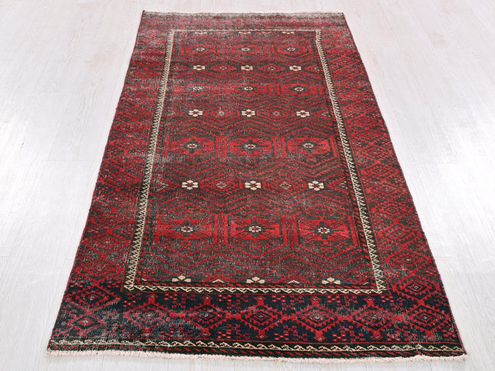 a red rug on a white floor in a room