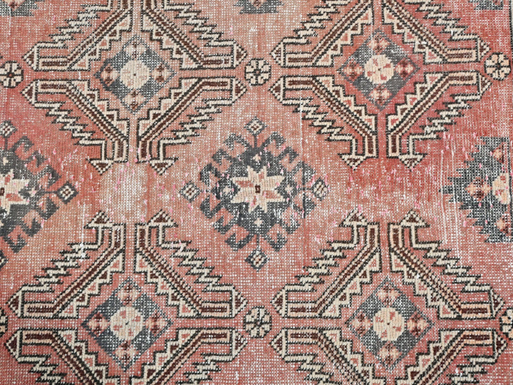 an old rug with a pattern on it