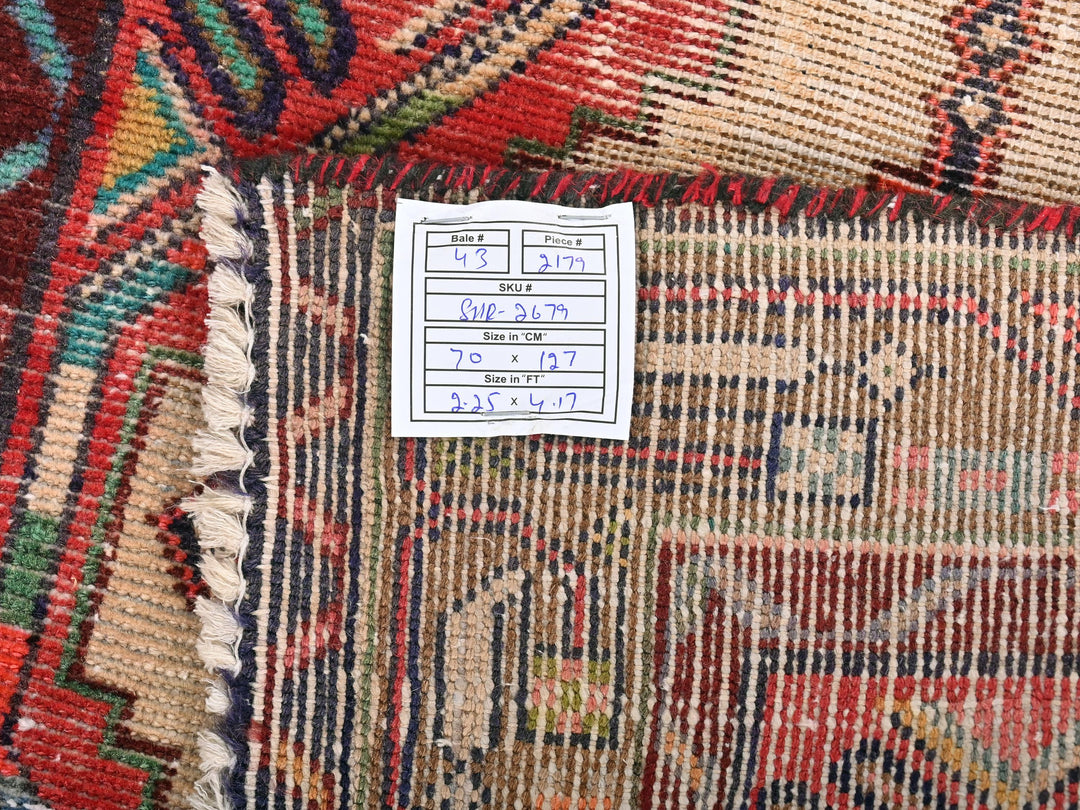 a pile of colorful rugs sitting on top of a table