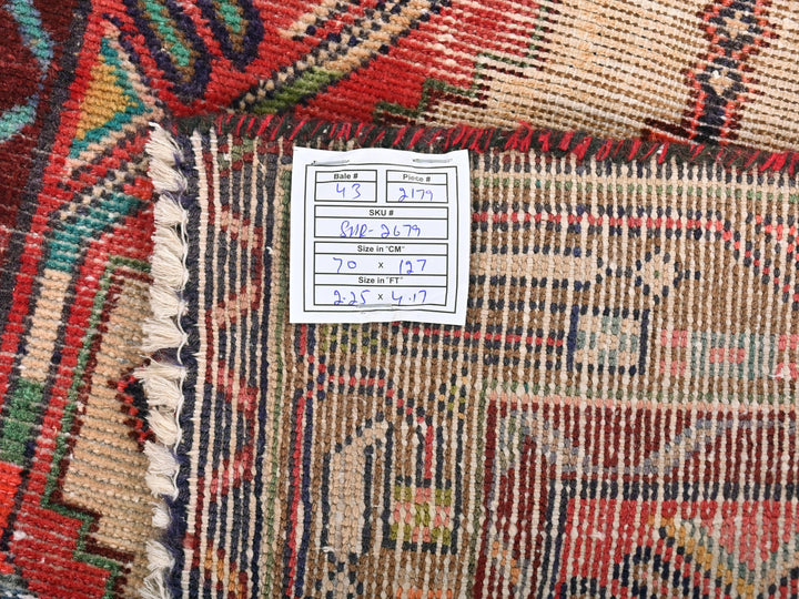 a pile of colorful rugs sitting on top of a table