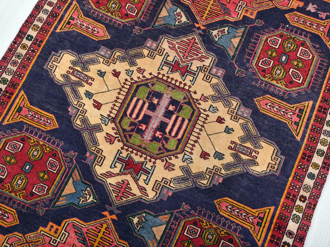 a colorful rug with a cross on it