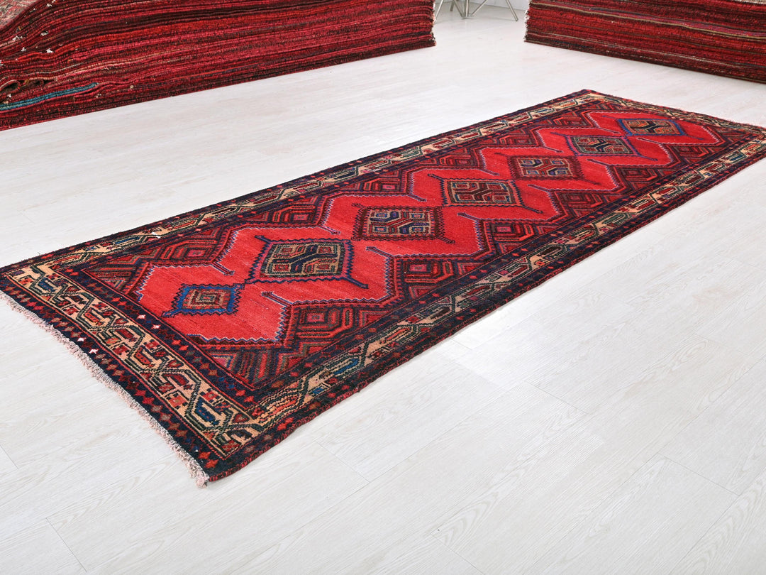 a red rug is laying on the floor