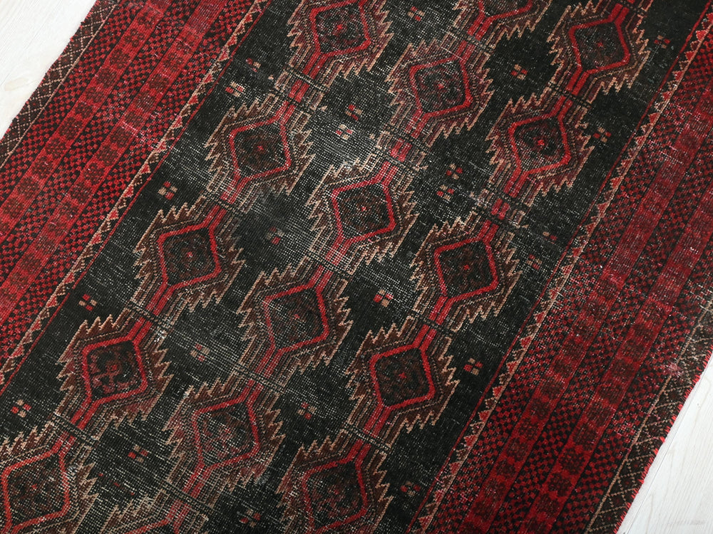 a close up of a rug on a wooden floor