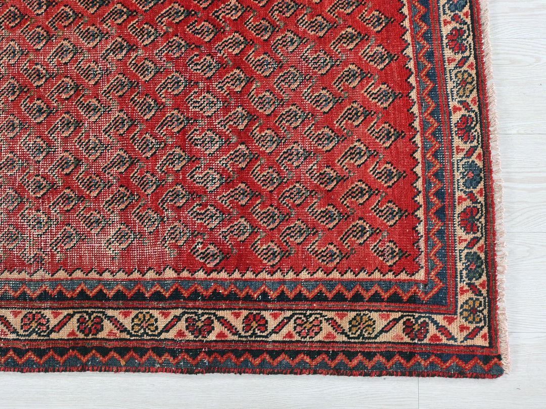 a red rug on a white floor