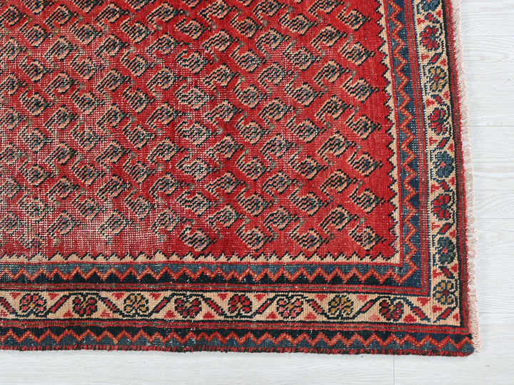a red rug on a white floor