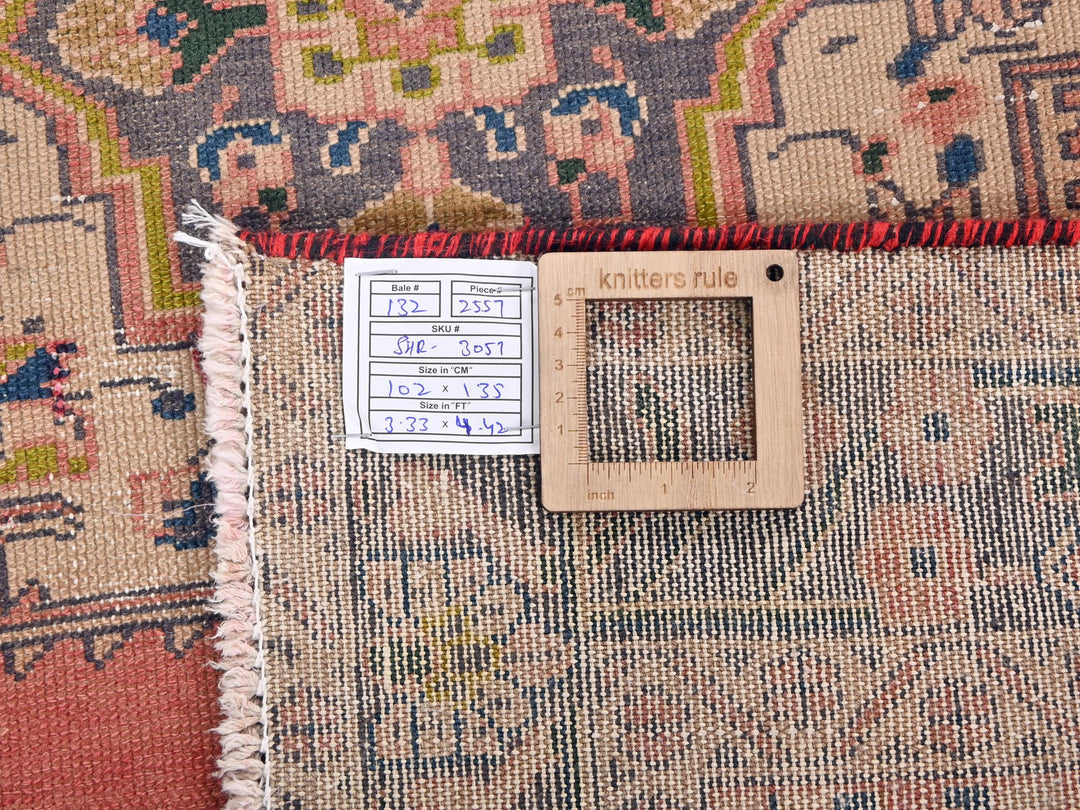 a rug with a ruler on top of it