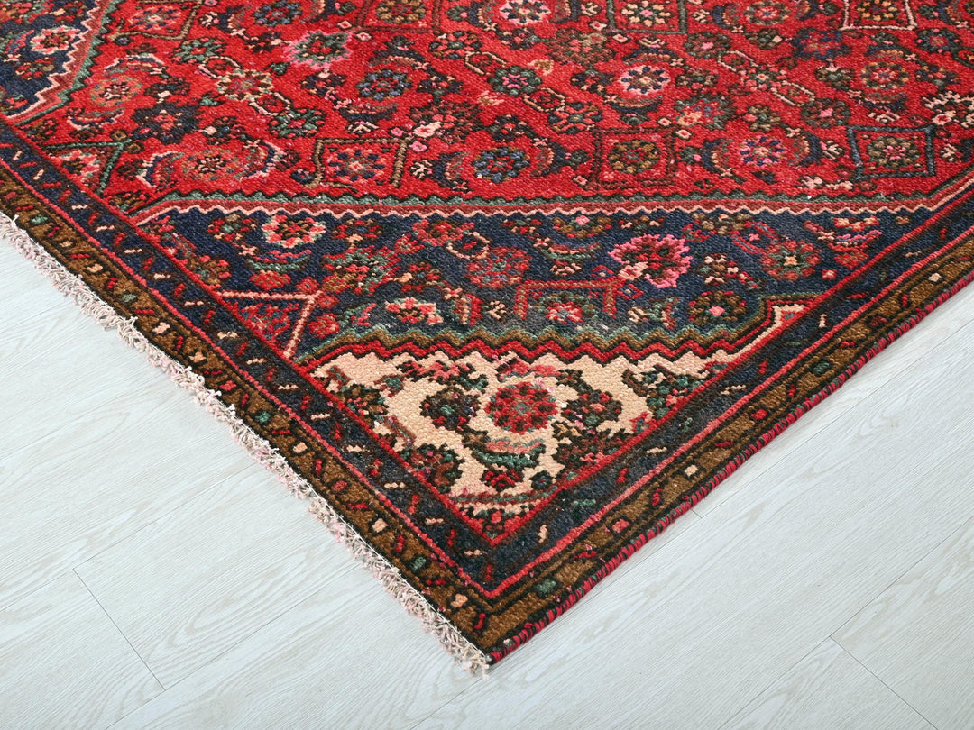 a red rug on a white floor in a room