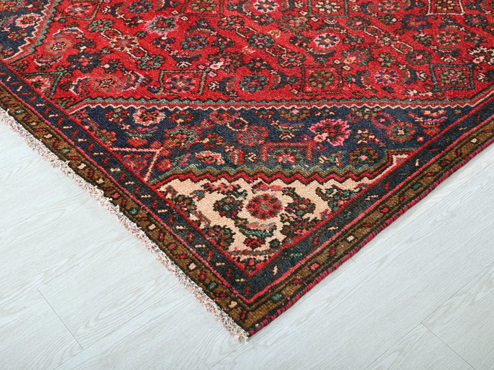 a red rug on a white floor in a room