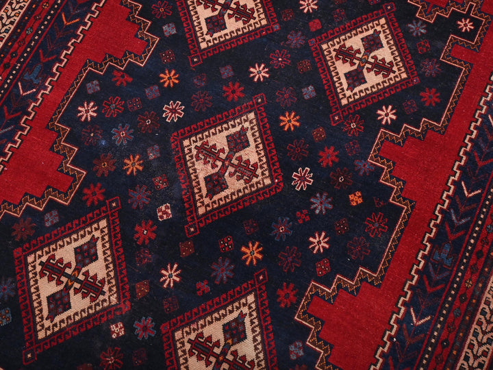 a close up of a red and blue rug