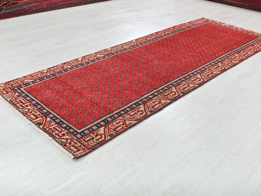 a red rug is laying on the floor
