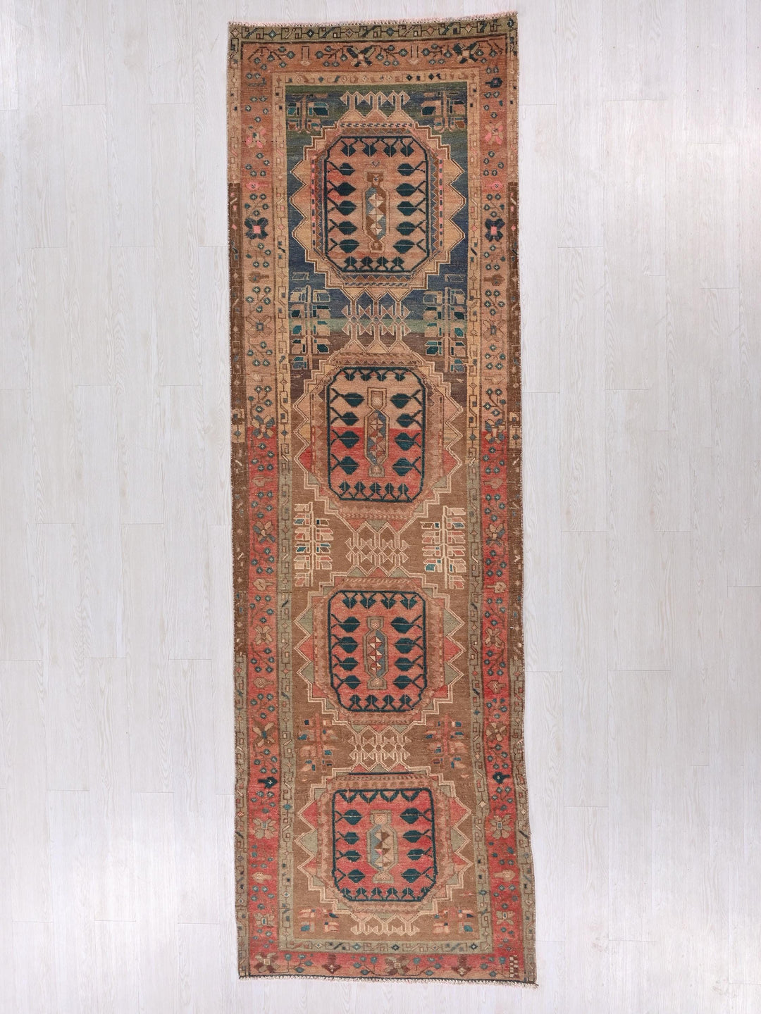 a rug hanging on a wall in a room