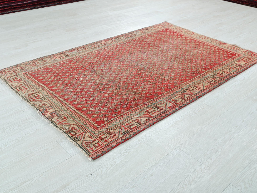 a red rug on the floor of a room