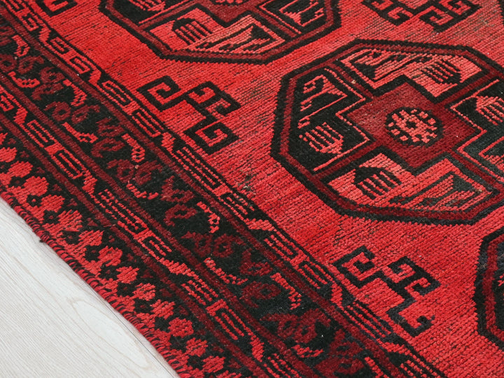 a close up of a red oriental rug