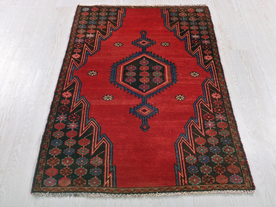 a red rug on a white floor