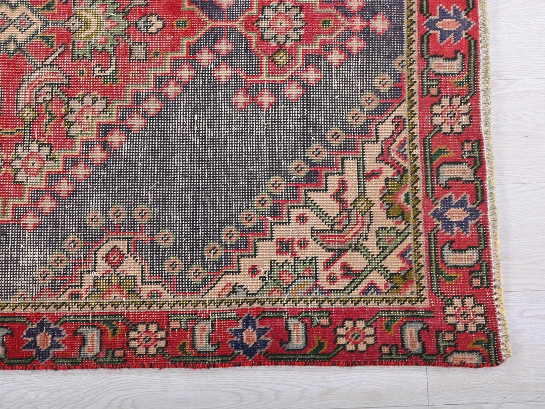a rug with a blue and red design on it