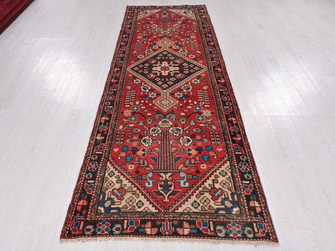 a red rug on a white floor in a room