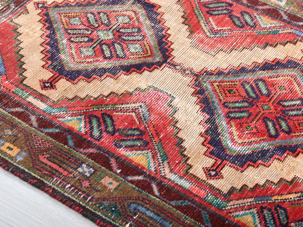 a multicolored rug with a pattern on it