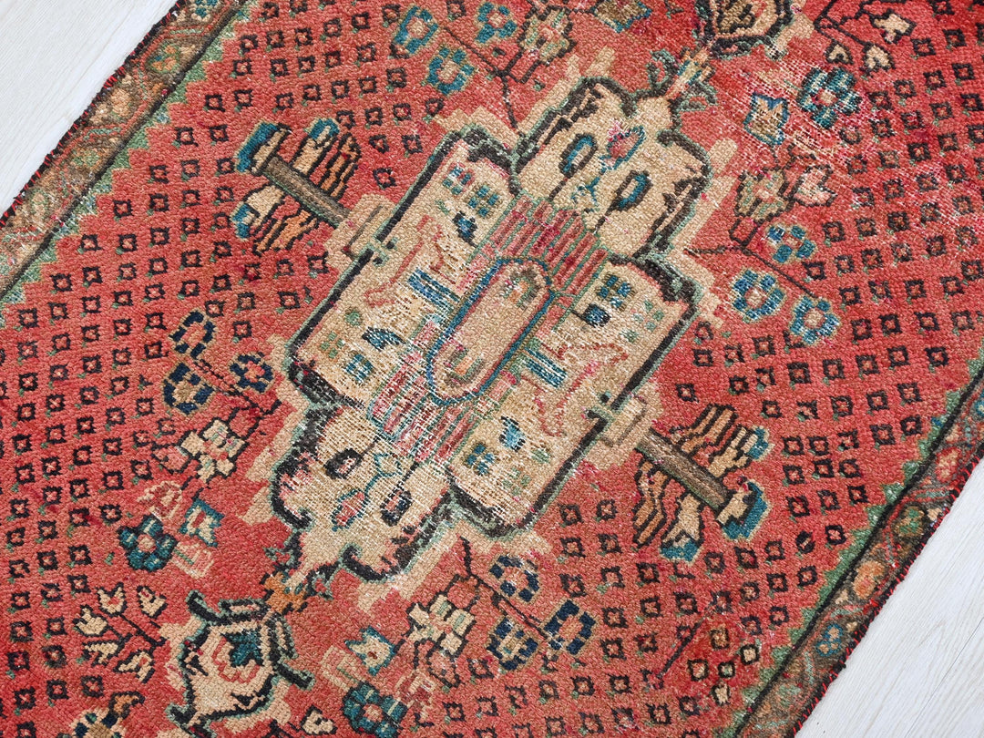a close up of a rug on a wooden floor
