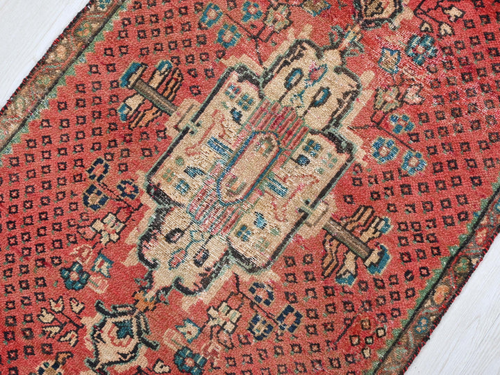 a close up of a rug on a wooden floor