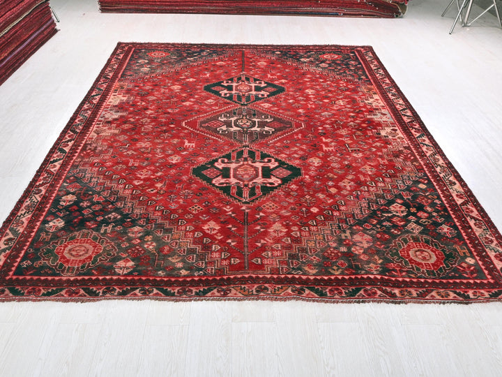 a large red rug on a white floor