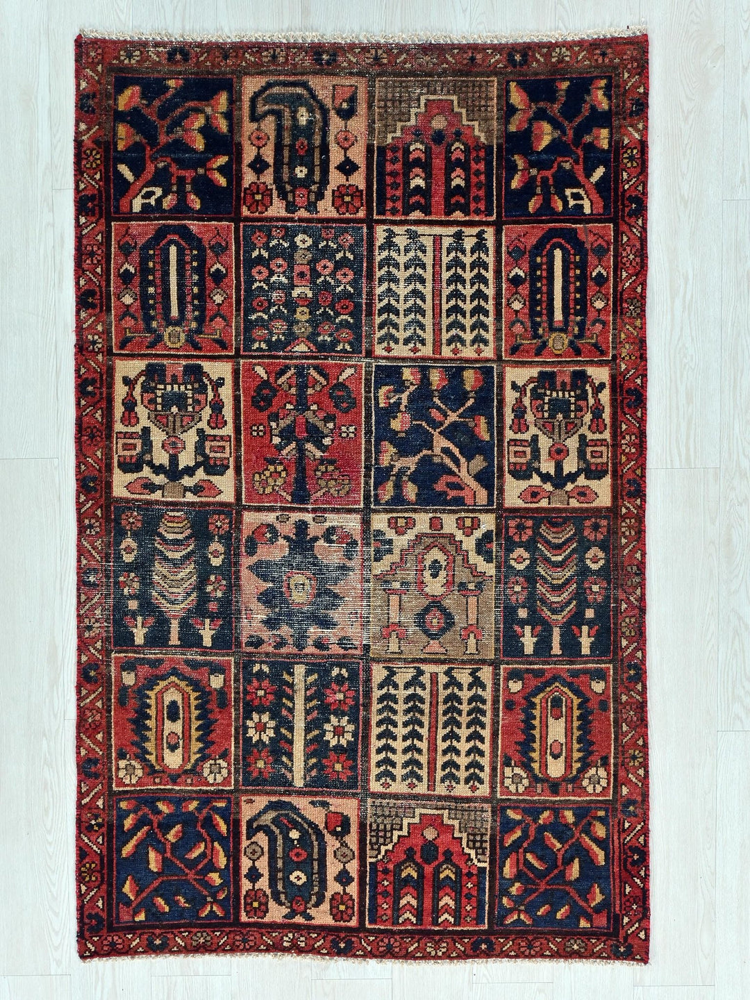 a multicolored rug with many different designs on it